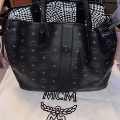 Mcm Brand New Tote Bag W 18” X H 11” Hardware Still Have Plastics On It. Designer Black Bags With Large Capacity, Designer Black Bag With Large Capacity, Designer Black Bags Large Capacity, Designer Black Top Handle Bags, Designer Black Bag With Detachable Handle, Black Designer Bag With Detachable Handle, Designer Black Bag With Handles, Designer Black Bags With Handles, Top Handle Black Shoulder Bag For Errands