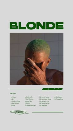 a man with green hair covering his face in front of a white poster that says blonde