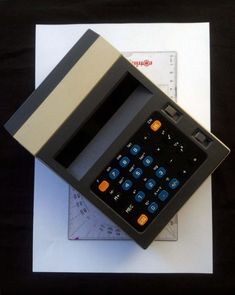 a calculator sitting on top of a piece of paper