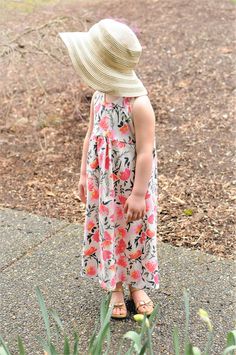 A floral maxi dress that will have your little miss feeling like a summer princess! Maxi dresses are so comfortable and this boho floral is gorgeous. This maxi dress features a racer-back tank. All seams are serged and the neckband and bottom hems are top-stitched for a professional finish and durability. Our fabrics are always pre-washed in free and clear detergent. Made in a smoke-free home. Care: Please wash on gentle cycle in warm water. Do not wash with other clothing or Velcro items! Dry f Cute Sleeveless Floral Dress For Beach, Beach Floral Cotton Dress, Cute Flowy Sundress For Beach, Cute Flowy Beach Sundress, Cute Flowy Sundress For Vacation, Cute Flowy Floral Dress For Summer, Cute Summer Beach Maxi Dress, Cute Pink Floral Dress For Beach, Cute Flowy Floral Summer Dress