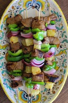 skewered meat and vegetables on a plate