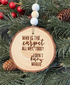 a wooden ornament hanging from a christmas tree