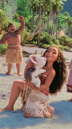 a woman holding a small white dog on top of a sandy beach next to other people