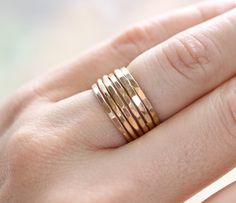 Beautiful and dainty hammered stacking bands. Perfect for everyday wear. Materials are 14k gold filled, not plated. These rings can be worn everyday and the color will not fade or chip off even if they get wet. The bands are approximately 1.5mm wide each. Keep in mind that if you are stacking more than 2 or 3 rings you may want to go up in size a bit. I can do multiple sizes in one set. Put your sizing requests in the notes at checkout if you want more than one size. Also available in solid gold Minimalist Hammered Stackable Rings In Recycled Gold, Gold Hammered Stackable Rings For Everyday Wear, Everyday Gold Hammered Stackable Rings, Gold Faceted Stackable Rings In 14k Gold, Faceted 14k Gold Stackable Rings, Minimalist Hammered Gold Stackable Rings, Everyday Adjustable Hammered Stackable Rings, Dainty Hammered Stackable Rings As Gift, 14k Gold Faceted Stackable Rings