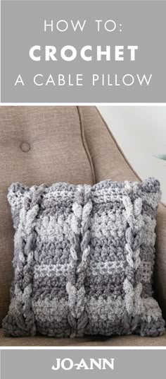 a crochet pillow sitting on top of a couch