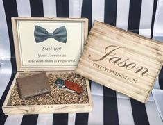 two personalized groomsmen gifts in a wooden box