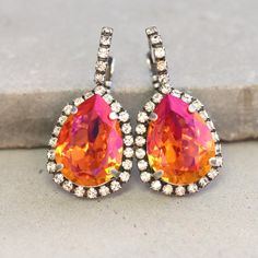 Orange Swarovski Earrings,Silver Orange Earrings,Swarovski Orange Pink Earrings,Volcano Earrings,Teardrop Silver Earrings,Orange Earrings♥IF YOU WANT THE BEST CHOSE THE ORIGINAL ♥Top Quality Materials ♥ Excellent Customer Service ♥ Swarovski Authentications Tags ♥ Petite Delights is an Official SWAROVSKI® Branding Partner Official Swarovski Elements® Partner Made with real genuine high quality Austrian Swarovski ©Crystal.Our brand is legally licensed & authorized By Swarovski Company for high qu Nickel Free Teardrop Clip-on Earrings For Party, Nickel-free Teardrop Clip-on Earrings For Party, Orange Teardrop Earrings For Party, Teardrop Silver Earrings, Glamour Jewelry, Orange Crystals, Yellow Jewelry, Swarovski Crystal Jewelry, Orange Earrings