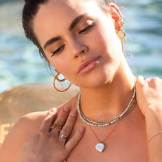 A one of a kind, natural Dominican Larimar is hand prong set, showcasing the stone's beauty. It hangs simply on a ball chain. Choose from 4 options: Heavy 14K Gold plated Brass pendant with a 14K Gold Filled chain, Solid 10K Gold pendant with a 14K Gold Filled chain, all Solid 10K Gold pendant and chain, or all Sterling Silver with a Rhodium plating. Heart is 18mm. The chain is 18" long. We can do custom lengths upon request. Dainty Teardrop Heart Charm Jewelry, Fine Jewelry Pearl Drop With Round Beads, Everyday Jewelry With Heart Charm And Round Beads, Dainty Jewelry With Heart Charm And Round Beads, Fine Jewelry Briolette Pearl Charm, White Gold Jewelry With Pearl Charm Round Beads, White Gold Jewelry With Pearl Pendant, Natural Stones Heart Pendant For Jewelry Making, Yellow Gold Heart Jewelry With Pearl Charm