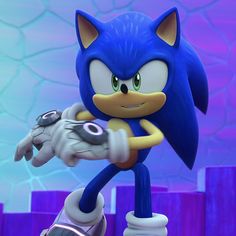 sonic the hedgehog is holding his arm out in front of him