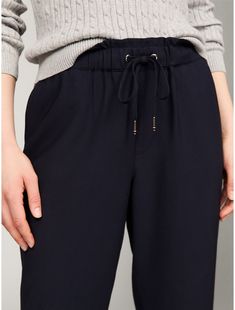 Tommy Hilfiger women's pant. Our comfortable pants are designed with a flattering tapered leg, and are made from a soft, lightweight blend. This versatile pair features side slash pockets, back patch pockets, and a jogger-inspired elastic drawstring waist for an easy fit.  Material: 93% Viscose, rayon, 7% Polyester. Wardrobe Pieces, Comfortable Pants, Viscose Rayon, Tommy Hilfiger Women, Back Patch, Drawstring Pants, Tapered Legs, Drawstring Waist, Tommy Hilfiger