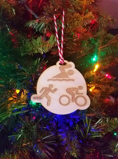 a wooden ornament hanging from a christmas tree