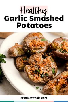 healthy garlic smashed potatoes on a white plate