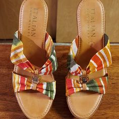 This Is A Pair Of Size 8, Colorful, Wedge-Heeled Sandals From Italian Shoemakers. Fabric Upper In Red, White, Orange, Yellow And Green Stripes. Lovely Clear Jewel In The Middle Of The Fabric. Sole Is Approximately 1.25 Inches With A 4-Inch Heel. Gorgeous, Brand New Shoes. Multicolor Platform Slip-on Wedge Sandals, Casual Multicolor Wedge Sandals, Casual Yellow Closed Toe Wedge Sandals, Casual Yellow High Heel Wedge Sandals, Spring Yellow Slip-on Wedge Sandals, Casual Multicolor Wedge Heels, 4 Inch Heels, Yellow And Green, Womens Shoes Wedges