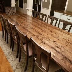 a large wooden table with chairs around it