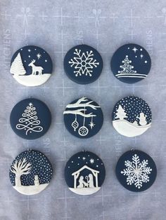 six buttons with christmas scenes on them