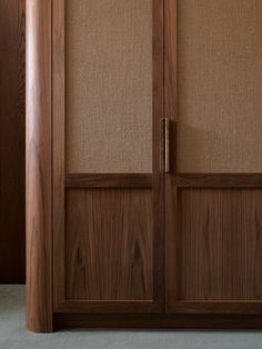 a close up of a wooden door with some fabric on the top and bottom panels