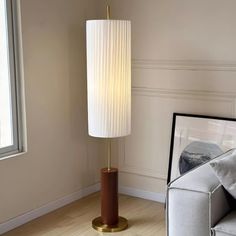 Brighten up your home with the Dorica floor lamp. This high-quality standing lamp adds a touch of sophistication to your space with its contemporary design and timeless style. Hallway Wall Lights, Office Light, Crystal Chandelier Kitchen, White Lampshade, Tiffany Style Table Lamps, Japanese Interiors, Chandelier Art, Kitchen Island Chandelier, Recessed Wall Lights