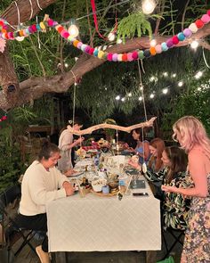 a group of people sitting around a table