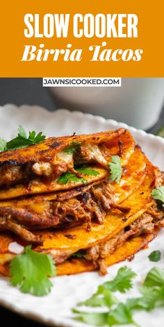 slow cooker burrito tacos on a white plate with cilantro garnish