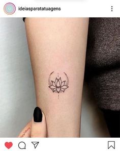 a woman's arm with a lotus tattoo on the left side of her body