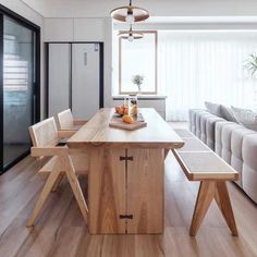 a wooden table sitting in the middle of a living room