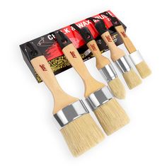 four paint brushes are lined up next to each other