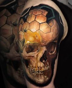 a man's skull with honeycombs painted on his face and chest is shown