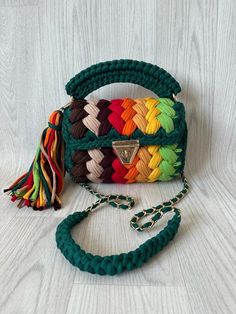 a multicolored handbag on a white background