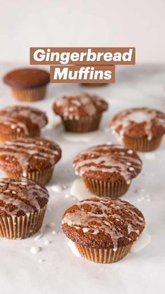 chocolate cupcakes with icing and sprinkles on a white surface