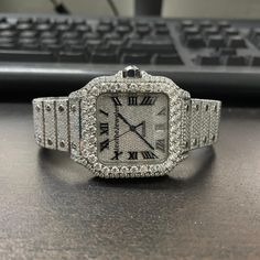 Moissanite Watch iced out watches / Luxury Fully Automatic VVS Moissanite Diamond Iced Out Hip Hop Buss Down Watch / Moissanite Watch Movement: Automatic Movement * Watch Metal: 904 Stainless Steel * Band Metal: 904 Stainless Steel * Indices: Simple Line * Dial Window Material Type: Glass * Water Resistant :- No * * Diamond Details * * * Type: Moissanite * Creation: Lab Made * Shape: Round Brilliant Cut * Clarity: VVS1 (TOP) * Color: D (Colorless / White ) * Cut: Excellent * Polish: Excellent * Our Moissanite will pass in diamond tester * Diamond Total Pieces: 2400 To 2800 Pieces * Diamond Carat Weight: 25.00 - 28.00 ct * Occasions: Wedding, Engagement, Valentine, Birthday, Anniversary, Christmas Gifts and Special Occasions * Note :- Prices are only for 1 watch & Only one watch will be shi Buss Down Watch, Bust Down Watch, Moissanite Watch, Iced Out Watches, Watch Gift For Him, Vvs Diamond, Diamond Ice, Diamond Tester, Band Metal