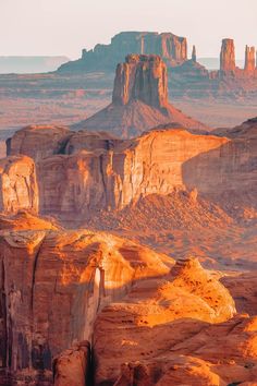 the desert is full of rock formations and mountains