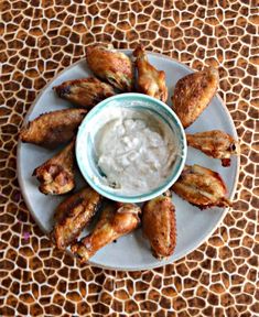 chicken wings on a plate with ranch dip