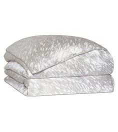 two white pillows sitting on top of each other