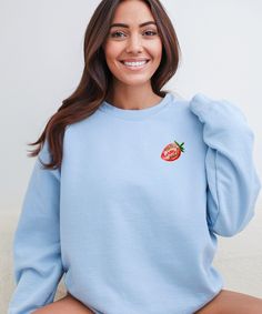 Cute Strawberries Sweater for all Strawberry-lovers! This sweatshirt feels cozy and comfortable. * PRODUCTION TIME *  1-5 days (Usually 2-3 days) * SHIPPING TIME *  2-5 days (Usually 3 days) * PRODUCT DESCRIPTION *  Unisex Gildan 18000 Crewneck Sweatshirt Made with a medium-heavy fabric blend of 50% cotton and 50% polyester (8.0 oz/yd² (271.25 g/m²) Made using 100% ethically grown US cotton.  Fabric blends: Heather Sport colors - 60% polyester, 40% cotton For Sweatshirt Sizes - Please refer to the Listing Image. * CARE INSTRUCTION *  Machine wash: cold (max 30C or 90F) Non-chlorine: bleach as needed Tumble dry: low heat Do not iron Do not dryclean. Cute Relaxed Fit Hoodie With Crew Neck, Long Sleeve Cotton Tops With Strawberry Print, Casual Long Sleeve Tops With Strawberry Print, Strawberry Hoodie, Strawberry Sweater, Berry Good, Strawberry Shirt, Cute Strawberry, Heavy Fabric