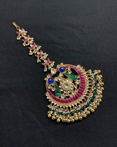 *It's Handmade Kundan Mangtikka for Indian Brides. *It's made from Silver n Copper with Pink,Green and White Kundan Stones Settings with 22k gold Plating as shown in picture. *It's 2 Inch size. *Our all jewelry is made from semiprecious stones and beads. *WARRANTY: ITS GENUINE HANDMADE JEWELRY AND WE ARE GIVING LONG LIFE WARRANTY FOR OUR ALL ITEMS. All of our Kundan Jewelry is 100% handmade with ancient Kundan stone setting method using silver foils. It is one of the most favorable jewelry since Traditional Cutdana Dupatta For Marriage, Kundan Bridal Accessories With Tilla For Marriage, Tilla Tikka For Marriage And Festivals, Traditional Festive Wedding Hair Accessories, Traditional Wedding Festive Headpiece, Traditional Bridal Accessories With Stone Work For Marriage, Traditional Kundan Tikka For Marriage, Ceremonial Kundan Tikka With Motifs, Bollywood Style Tikka For Festive Marriage