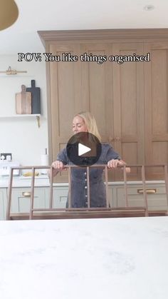 a woman standing in front of a kitchen counter top with the words pov on it