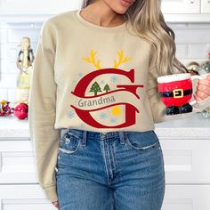 Celebrate the holidays with this cozy Grandma Sweatshirt. Perfect for every grandma who enjoys the holidays and festivities, this playful sweater brings a touch of fun to the Christmas season. Whether relaxing by the fireplace, decorating the tree or making those cookies with the grandchilds, every grandma will love this comfy addition to his holiday wardrobe. This sweatshirt offers warmth and coziness, perfect for winter days. Available in festive colors and various sizes, it makes an excellent Christmas gift for grandmothers or a fun outfit for holiday gatherings. Why You'll Love It: This sweatshirt combines comfort, and holiday spirit, making it an instant favorite for grandma. It's perfect for lounging at home, enjoying Christmas treats, or gathering around the fireplace with family. P Fireplace Decorating, Grandma Sweatshirt, Grandma Christmas, Christmas Apparel, Grandmas Christmas, Christmas Gifts For Grandma, Holiday Wardrobe, Holiday Gathering, Cozy Fashion