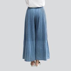 Introducing the 2023 Spring-Summer Collection the Pleated Culottes Women's Denim Pants Y2K Style. the perfect combination of timeless and vogue trend. Crafted from high-quality denim fabric. these jeans offer a flattering high-waisted fit with a rubber closure and light wash finish. With a unique year-2000 design. these divided-skirt are a testament to vogue fashion and classic charm.Why These Jeans Should Be Your Next Purchase Modern Y2K Design: Featuring a unique y2k design. these jeans are th Baggy Denim Blue Pants For Spring, Pleated Wide Leg Bottoms For Fall, Casual Pleated Wide Leg Pants For Fall, Spring Bottoms In Dark Wash With Pockets, Spring Bottoms With Pockets In Dark Wash, Spring Denim Blue Loose Fit Jeans, Fall Pleated Wide Leg Bottoms, Dark Wash Bottoms With Pockets For Spring, Fall Wide Leg Pleated Bottoms