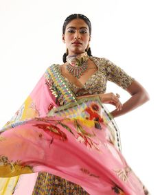 Editor's Note Featuring a printed heavy embroidered lehenga and blouse with dupatta Fabric: Satin organza, shantoon, organza Color: Multicolor Components: Lehenga, blouse and dupatta Occasion: Sangeet Care: Dry Clean Only About the Designer Mahima Mahajan has injected a breath of fresh air into the Indian fashion industry with her bespoke collection of decorous designs. Her approach to designing can be described as both fashionable as well as functional. The designs applied by Mahima Mahajan por Pink Pre-draped Saree With Printed Motifs For Festivals, Semi-stitched Digital Print Choli For Wedding, Festive Multicolor Organza Pre-draped Saree, Festive Chanderi Lehenga With Printed Motifs, Festive Lehenga With Printed Motifs In Traditional Drape, Saree Sets With Printed Motifs For Reception, Chanderi Pre-draped Saree With Printed Motifs For Wedding, Reception Lehenga With Printed Motifs In Georgette, Organza Sets With Printed Motifs For Festivals