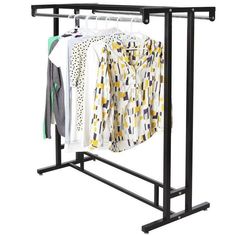 an ironing rack with clothes hanging from it's sides and two shirts on hangers