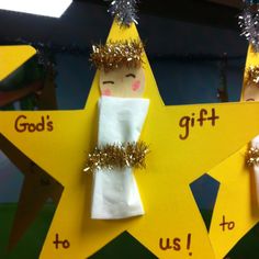 an ornament made to look like a star with angels on it