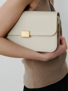 Our best selling classic shoulder bag now comes in a pebble cream leather as requested by so many of our customers. Born out of the desire for a classic and understated accessory that can elevate any outfit effortless and take you from work to weekend. Classic Cardigan, Classic Coats, Summer Scarves, New Launch, Cow Leather, Dress Accessories, Sale Items, Bags Designer, Dust Bag