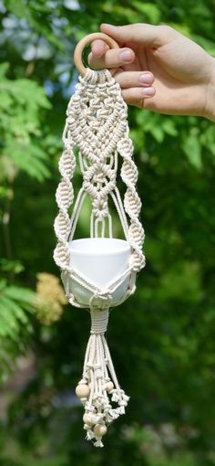 Handmade macrame plant hanger Free Macrame Patterns Hat Hangers, Macrame Hangers Diy, Outdoors Plant Stands, Macrame Plant Hanger Display, Macrame For Beginners Free Pattern, Macrame Mini Plant Hanger Tutorial, Macrame Plant Hanger Tutorial Free, Macrame With Paracord, Mini Plant Hanger Macrame Diy