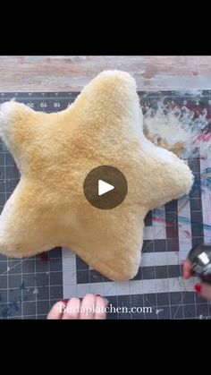 someone is making a star shaped stuffed animal