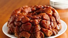 a bundt cake covered in nuts on a plate