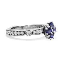 a white gold ring with blue sapphire and diamonds