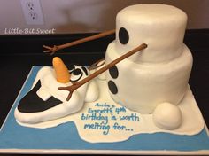 a birthday cake made to look like a snowman with his feet on the ground