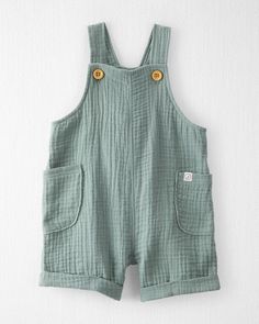 Spring Moss Green Baby Organic Cotton Gauze Shortall | carters.com Summer Bib Front Shortalls With Pockets, Cotton Bib Front Overalls In Solid Color, Solid Cotton Bib Front Overalls, Cotton Overalls With Bib Front, Cotton Shortalls With Side Pockets And Relaxed Fit, Summer Cotton Overalls In Solid Color, Solid Cotton Overalls With Bib Front, Cotton Sleeveless Shortalls For Spring, Sleeveless Cotton Shortalls For Spring