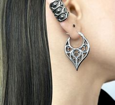 Unique pointy hoops are inspired by Gothic Cathedral elements.  Hoop are made of 316 Stainless steel. Size of the hoop : 37mm long,25mm wide Standard Post 22G Sold as 1 Pair Ships in a gift box *RETURNS / REFUNDS * -If you would like to return you purchase , please contact us within 7 days of receiving your package and we will accept the return.Return will only be made to the product, and not the shipping cost.  -Buyer is  responsible for the return shipping costs . -All jewelry must be returned unworn and in their original condition . *LOST MAIL* Once the package is marked as DELIVERED by the post office, we are not responsible for misplaced or stolen packages. *MAIL THEFT* If parcel is stoled or vandalized, please contact USPS mail theft department for further directions. We are not resp Cathedral Earrings, Jewelry Hoop Earrings, Earrings Gothic, Gothic Cathedral, Jewelry Gothic, Gothic Earrings, Unique Bracelets, Inspired Jewelry, Gothic Jewelry