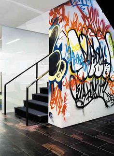 the stairs are covered with graffiti in an office building